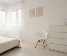 Simple exclusive white bedroom with wooden parquet-1